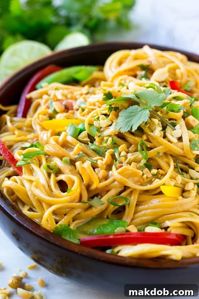 Creamy Thai Peanut Noodles 2 A bowl of Thai peanut noodles made with homemade peanut sauce, fresh vegetables and chopped peanuts. This vegetarian dish is quick to make.