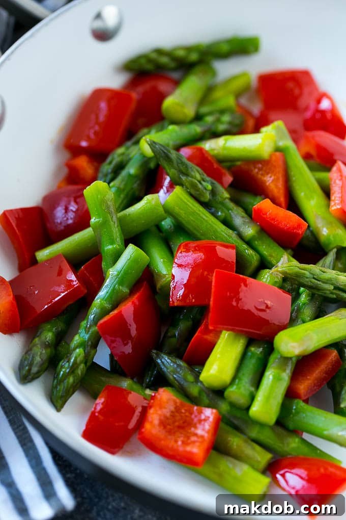 Sauteed vegetables like asparagus and red bell peppers form the base of this teriyaki chicken stir fry.