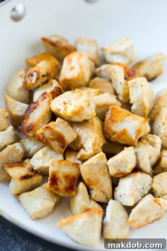 Perfectly browned chicken pieces, ready to be coated in the homemade teriyaki sauce for this healthy and delicious stir fry recipe.