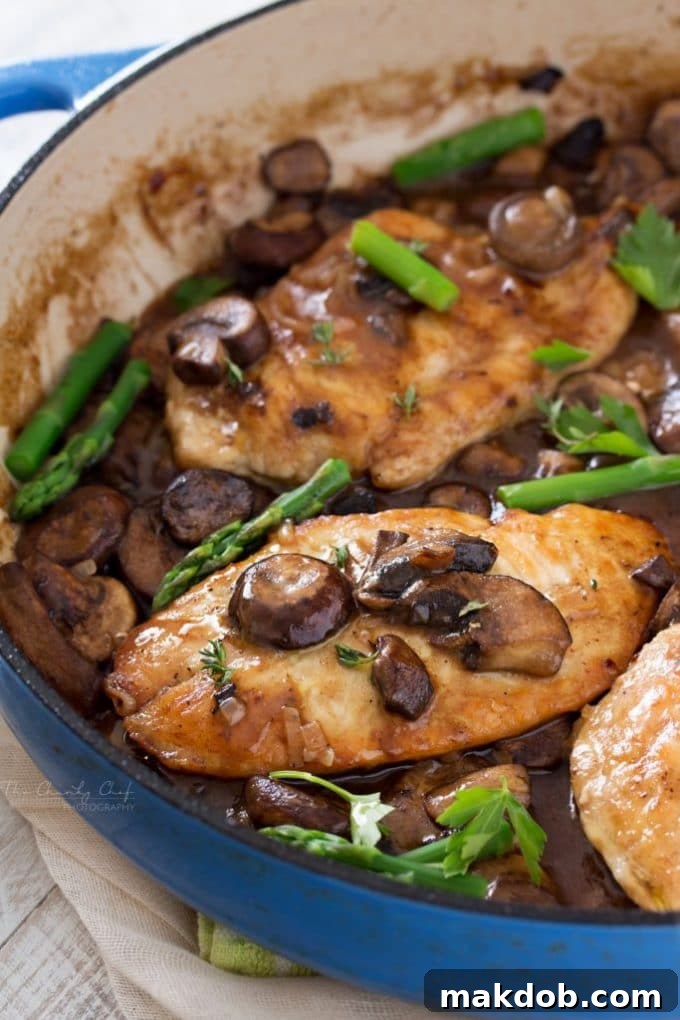 Easy Chicken Marsala with tender chicken cutlets and mushrooms in a rich Marsala wine sauce, garnished with parsley.