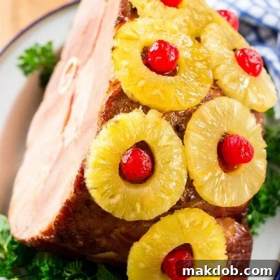 Pineapple Cherry Glazed Ham 5 This ham with pineapple and cherries is a classic recipe with one secret ingredient that really takes it over the top. The ULTIMATE holiday ham!