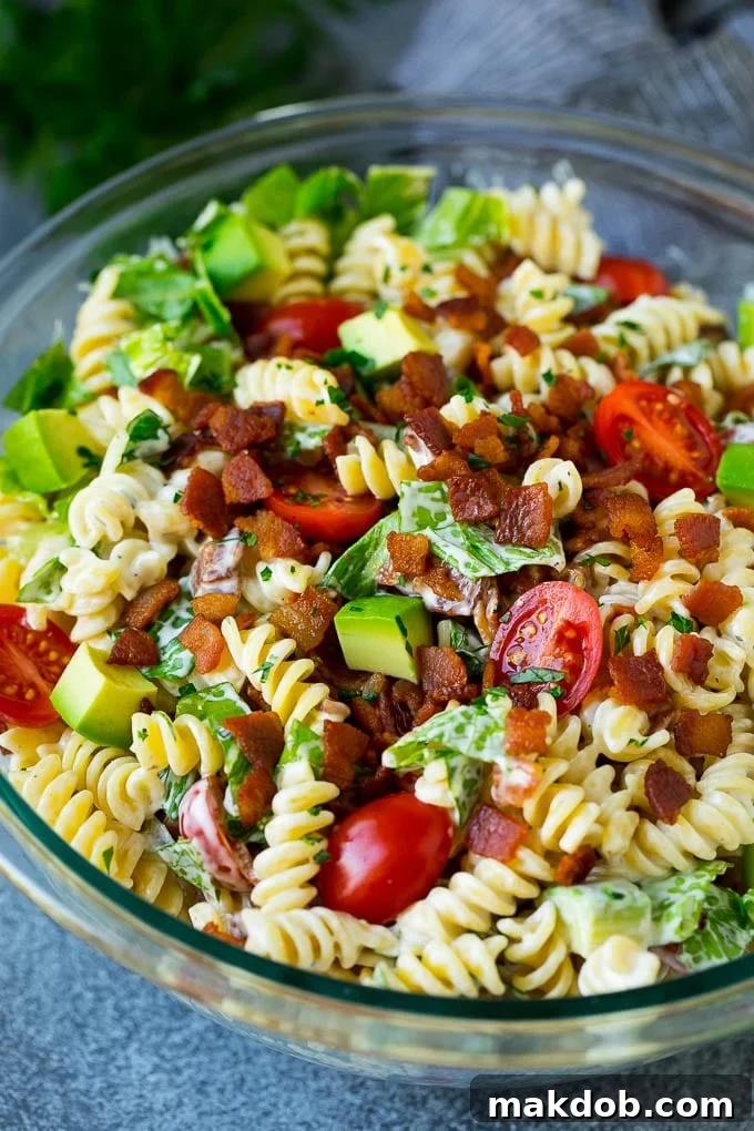 BLT Pasta Salad Recipe | Easy Pasta Salad | Bacon Pasta Salad #salad #pasta #blt #bacon #avocado #dinner #dinneratthezoo BLT pasta salad in a creamy ranch dressing, garnished with fresh parsley.