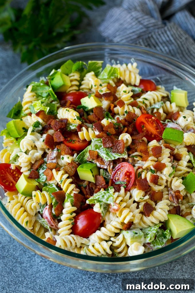 BLT Pasta Salad Recipe | Easy Pasta Salad | Bacon Pasta Salad #salad #pasta #blt #bacon #avocado #dinner #dinneratthezoo A beautifully presented bowl of BLT pasta salad, rich with avocado and creamy dressing.