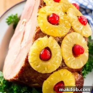 This ham with pineapple and cherries is a classic recipe with one secret ingredient that really takes it over the top. The ULTIMATE holiday ham!