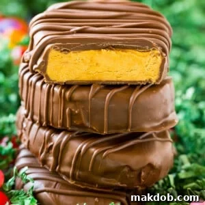 A stack of peanut butter eggs coated in chocolate.
