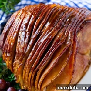 A whole spiral cut coca cola ham on a platter.