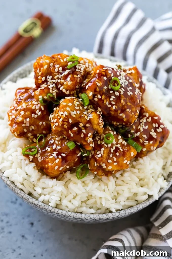 Sesame Chicken Recipe | Crispy Chicken | Asian Chicken #sesame #chicken #asian #dinner #dinneratthezoo Crispy sesame chicken served over steamed rice, garnished with sesame seeds and green onions.