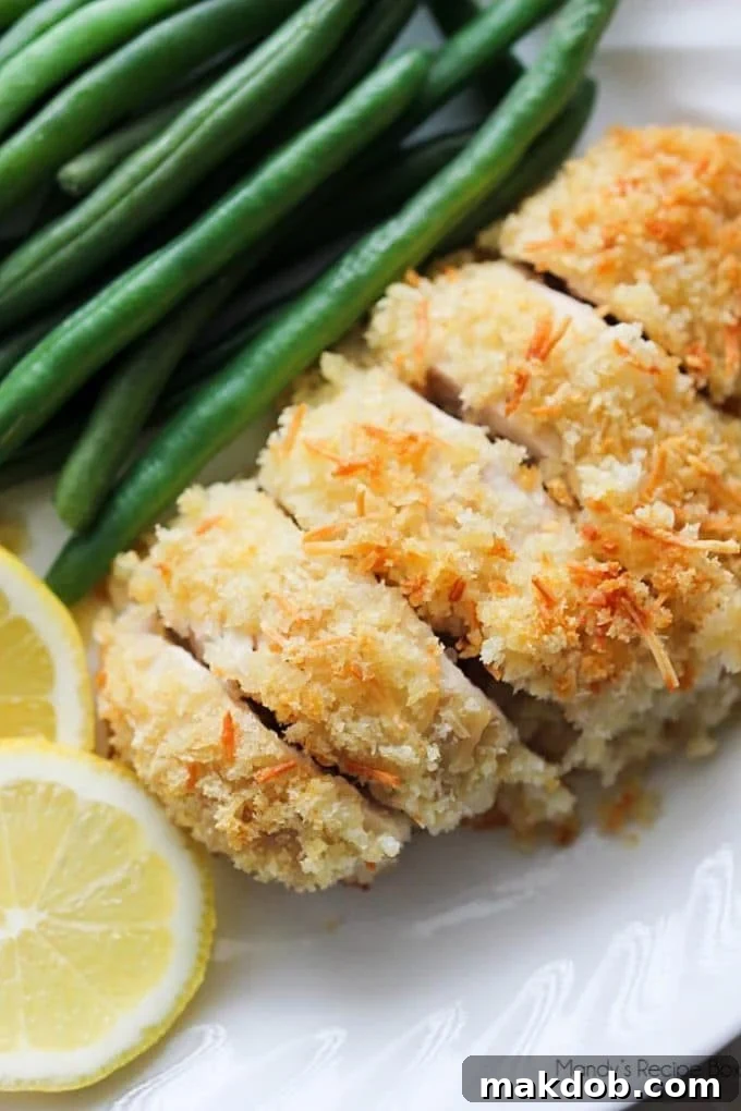Golden Lemon Parmesan Chicken served with fresh herbs