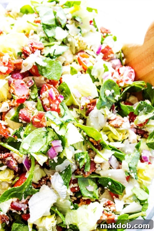 Effortless Sunday Meal Planning 6 Refreshing Chopped Wedge Salad with crisp iceberg lettuce, bacon, tomatoes, and a creamy blue cheese dressing, ideal for a hearty Tuesday meal.