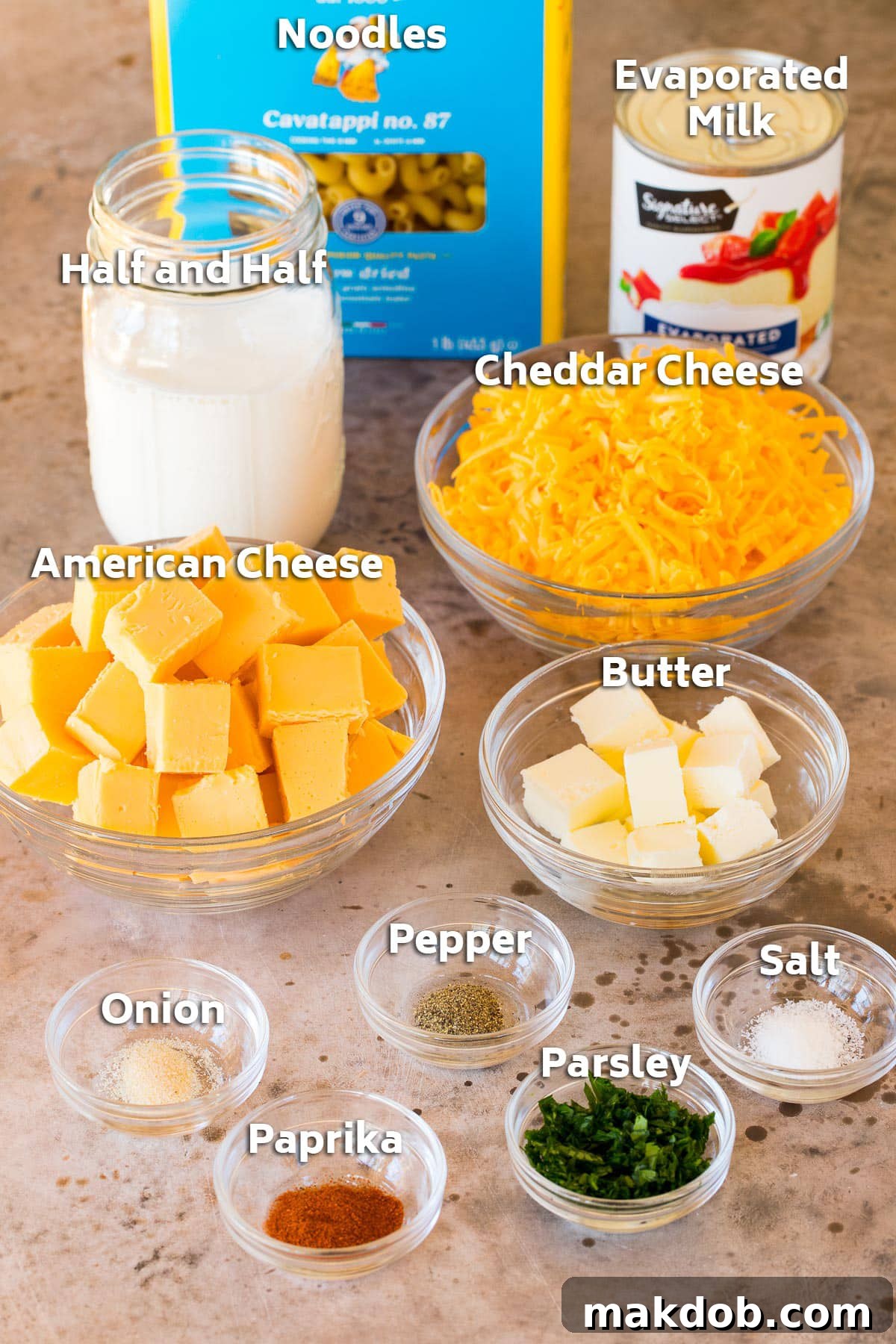 Ingredients including pasta, milk, cheeses, butter and seasonings.