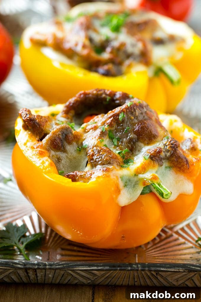 A bell pepper stuffed with meat, mushrooms and melted cheese.