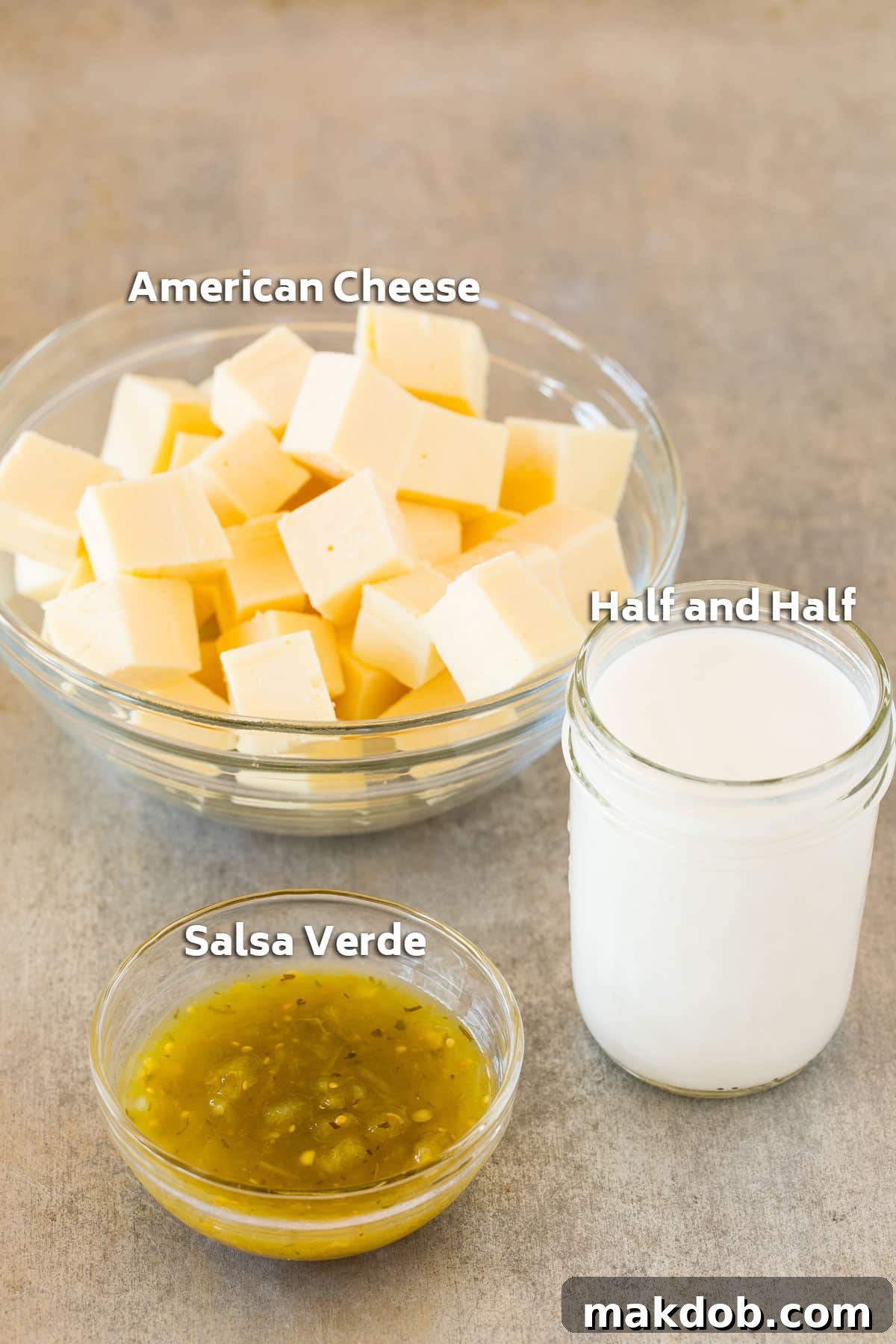 Velvety Queso Blanco 3 Bowls of ingredients including cheese cubes, half and half, and salsa.