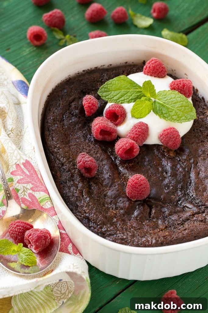 Close-up of the molten chocolate pudding layer at the bottom of the baked cake.