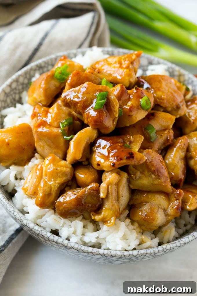 Sweet and savory chicken served over a bowl of rice.