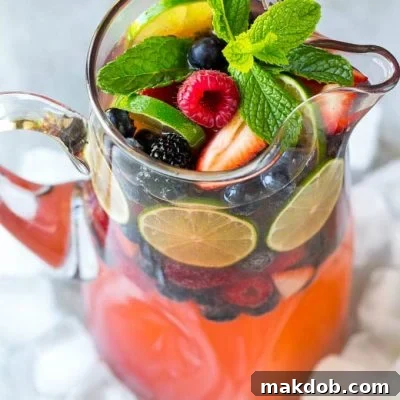 This berry champagne punch recipe is festive, refreshing and super easy to make! It's the perfect cocktail for any summer party.