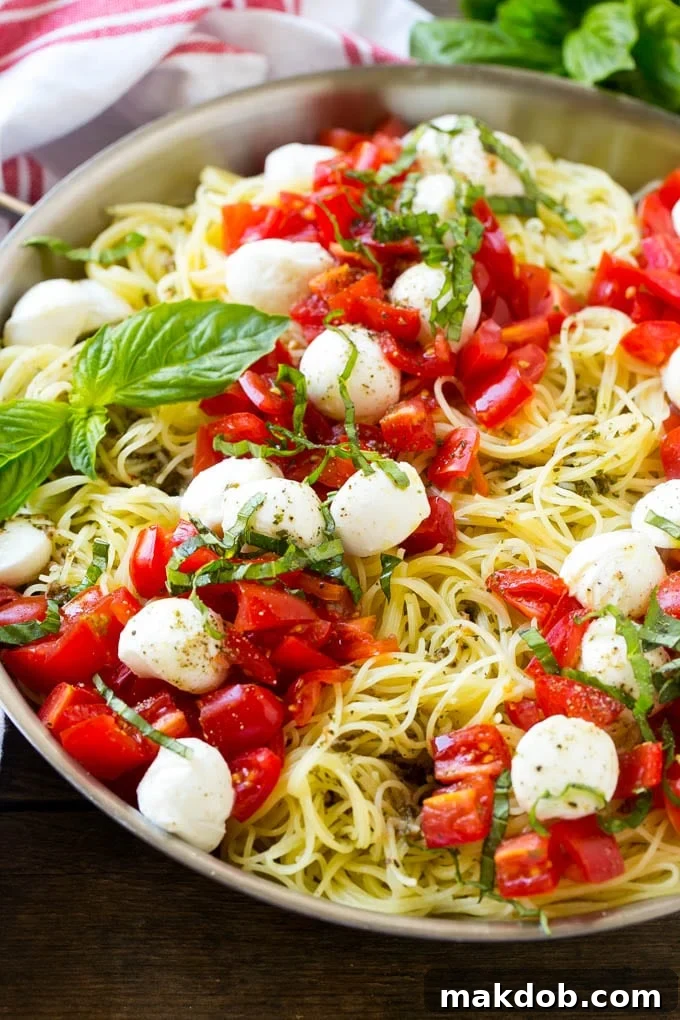 Caprese pasta with fresh diced tomatoes, mozzarella balls and thinly sliced basil.