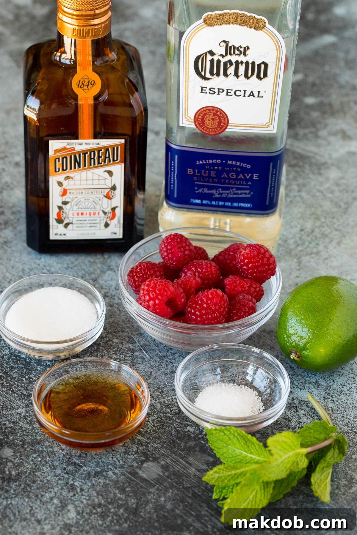 Ingredients including salt, sugar, agave syrup, raspberries, limes and tequila.