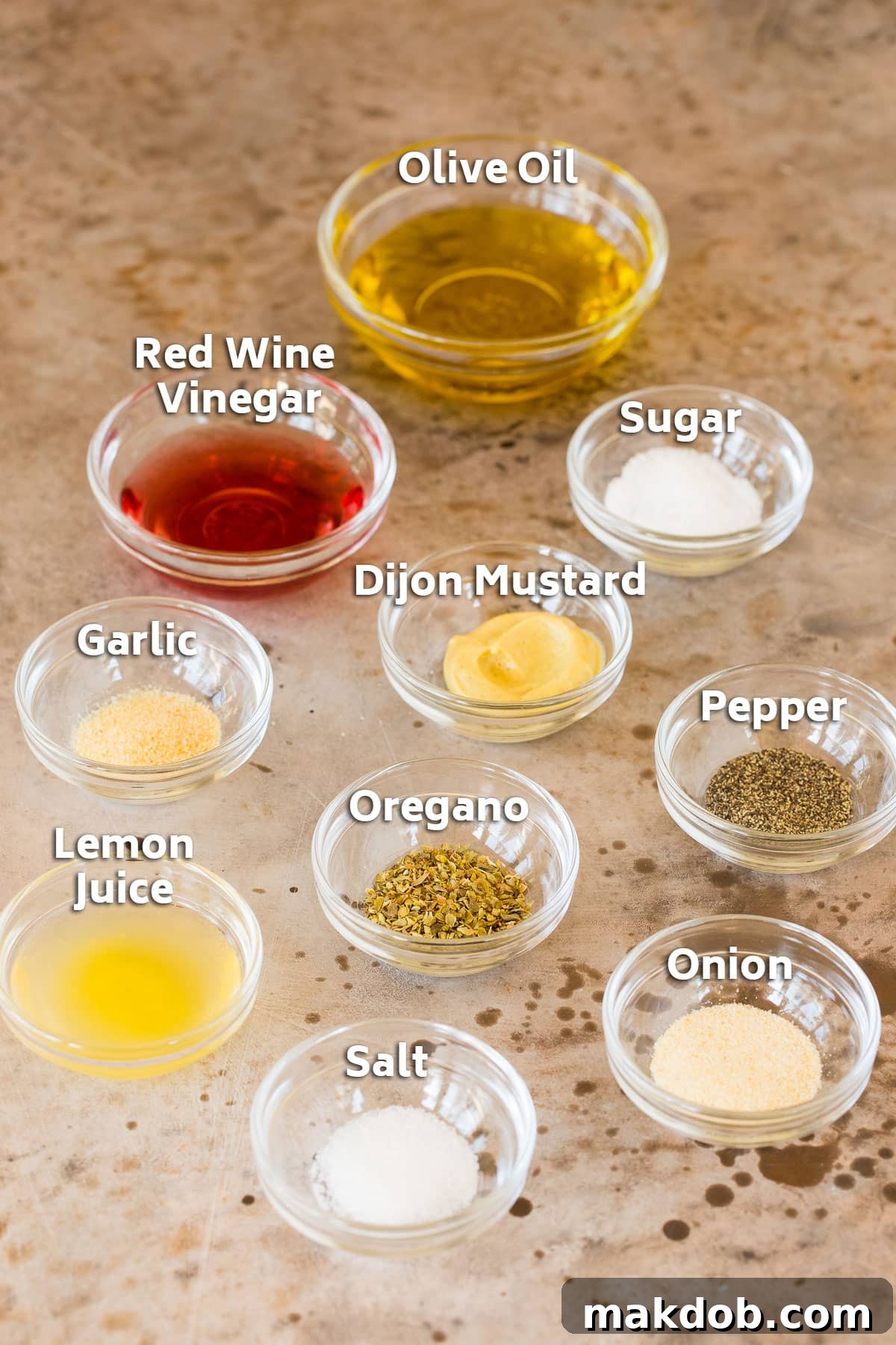 Salad dressing ingredients in bowls.