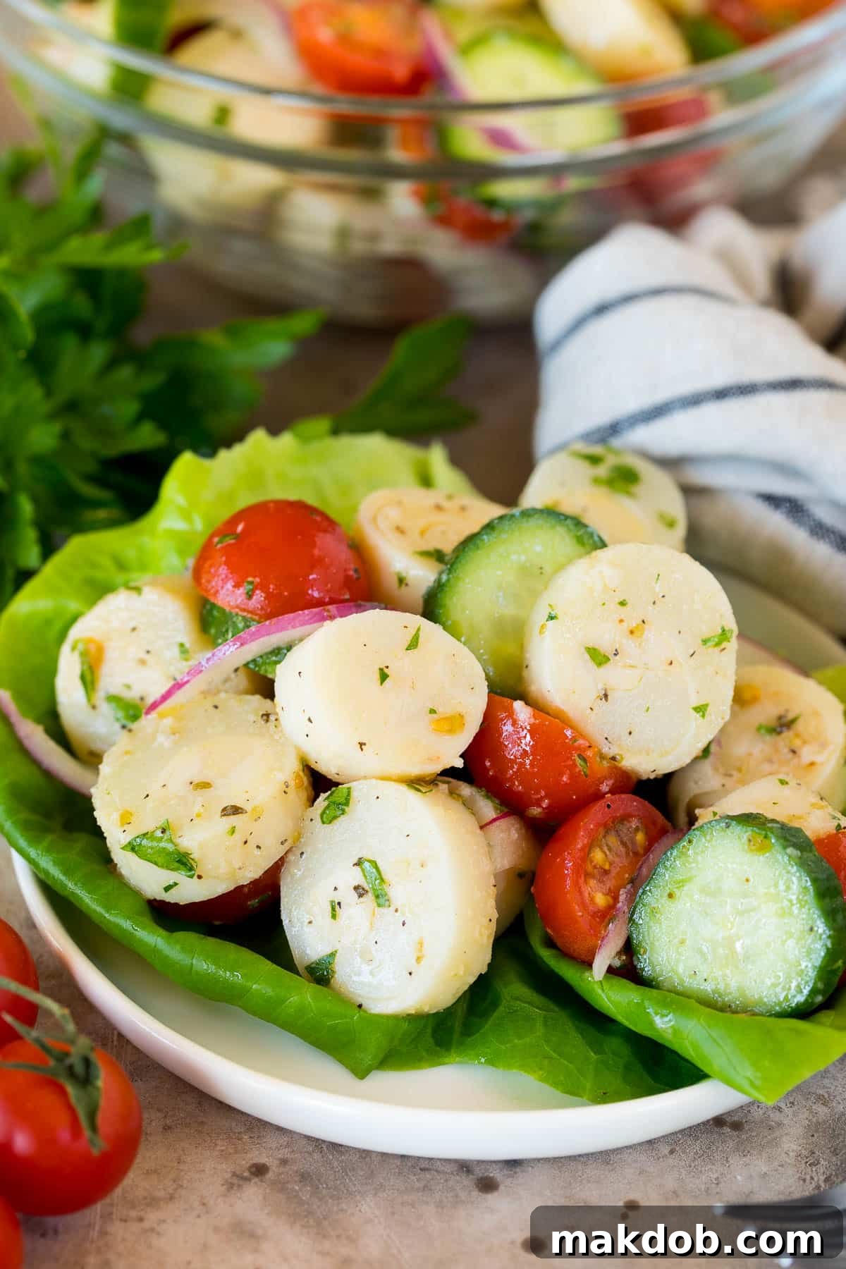 Hearts of palm salad served on a lettuce leaf.